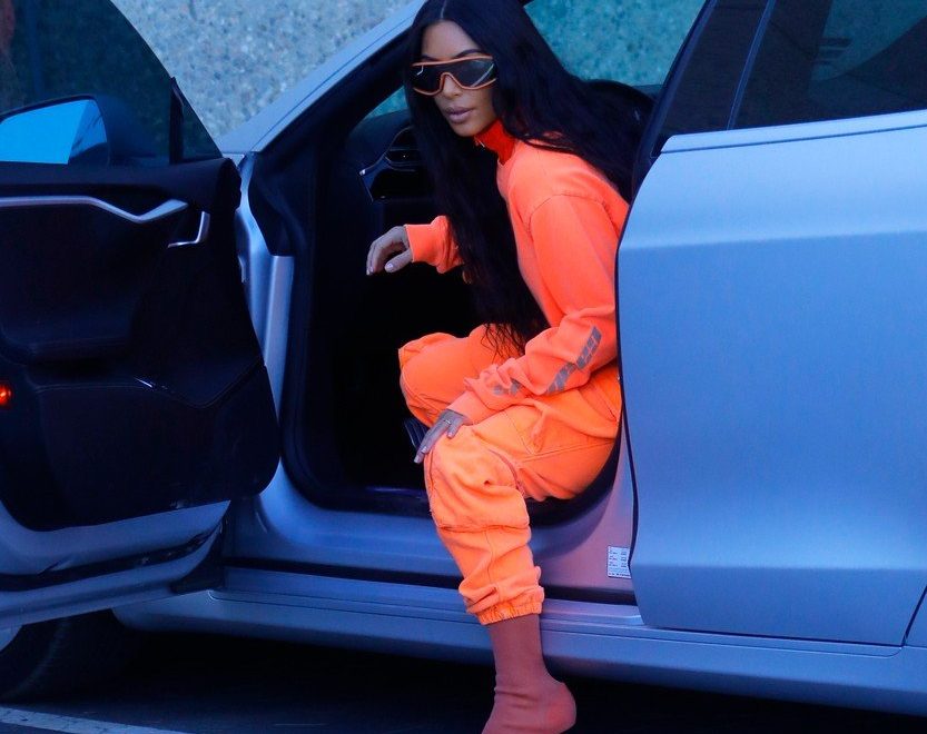 Kim is hard to miss in this crazy fluorescent outfit!